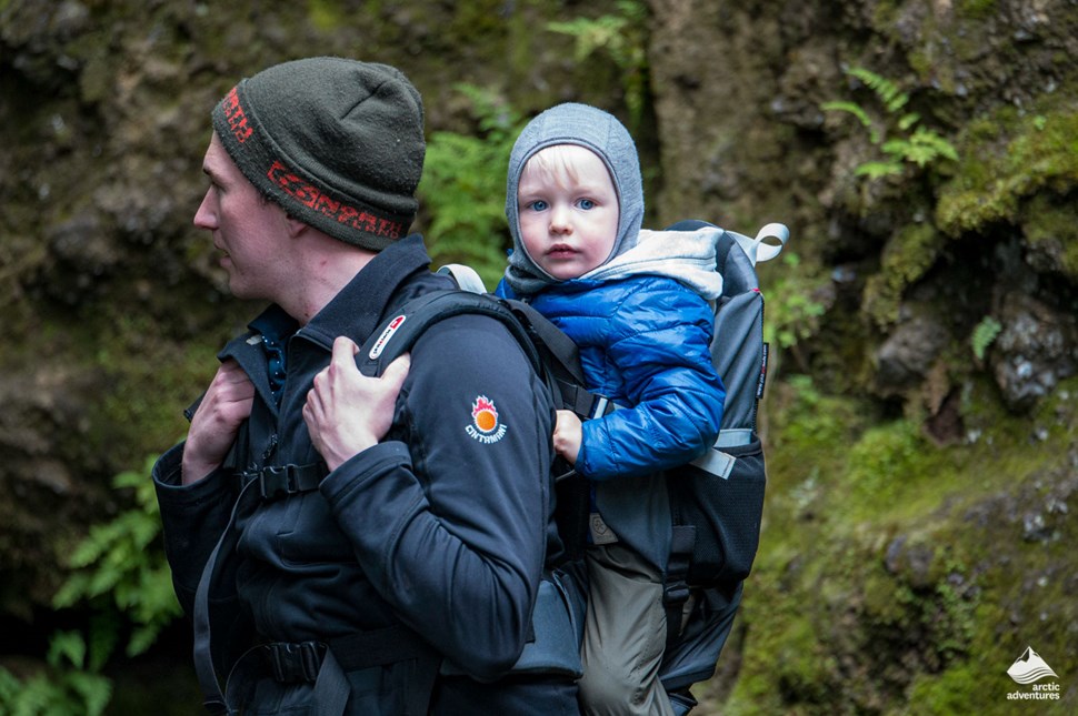Father with kid in the Icelandic forest
