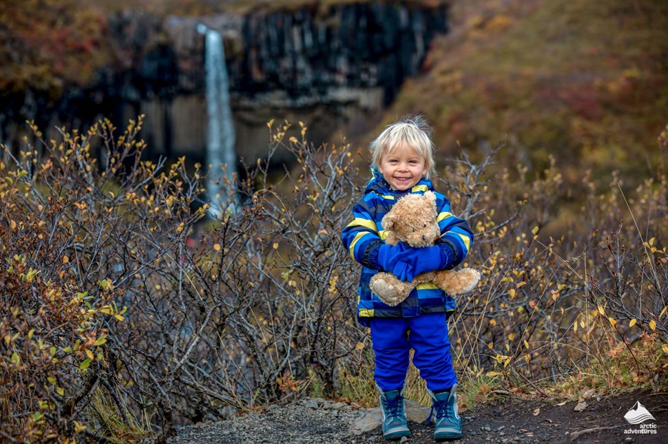 Boy with a toy near Svartifoss Waterpark