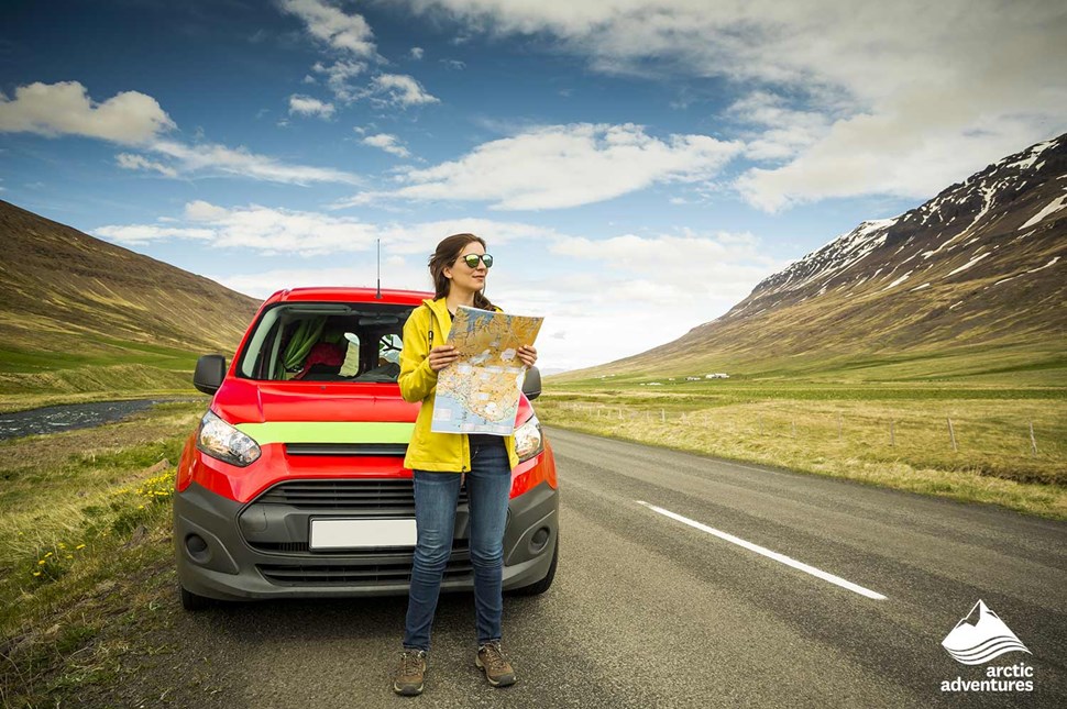 Girl with the map in Iceland on Road Trip
