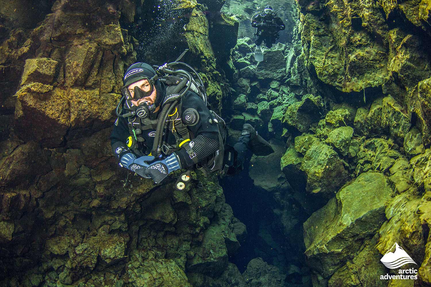 man Diving in Thingvellir National Park