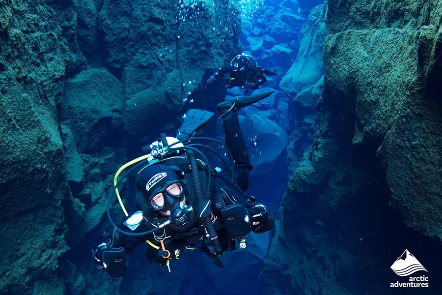 man diving in tectonic ravine