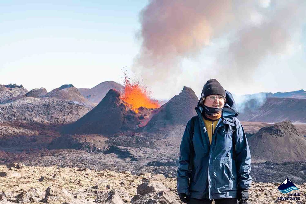 woman near volcano eruption