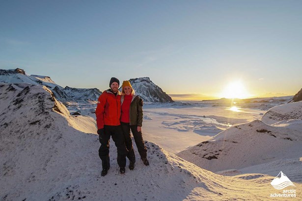 happy couple posing by sunset in Iceland