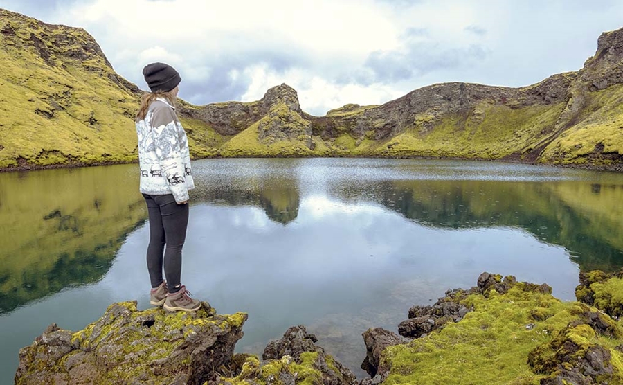 Woman looking to lake in Iceland