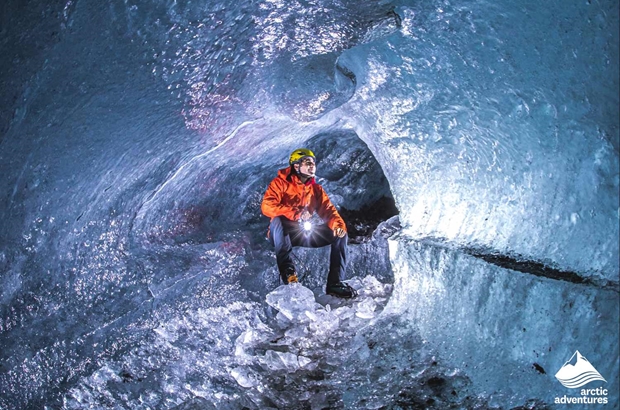 Man Glacier Hiking in ice cave on falljokull