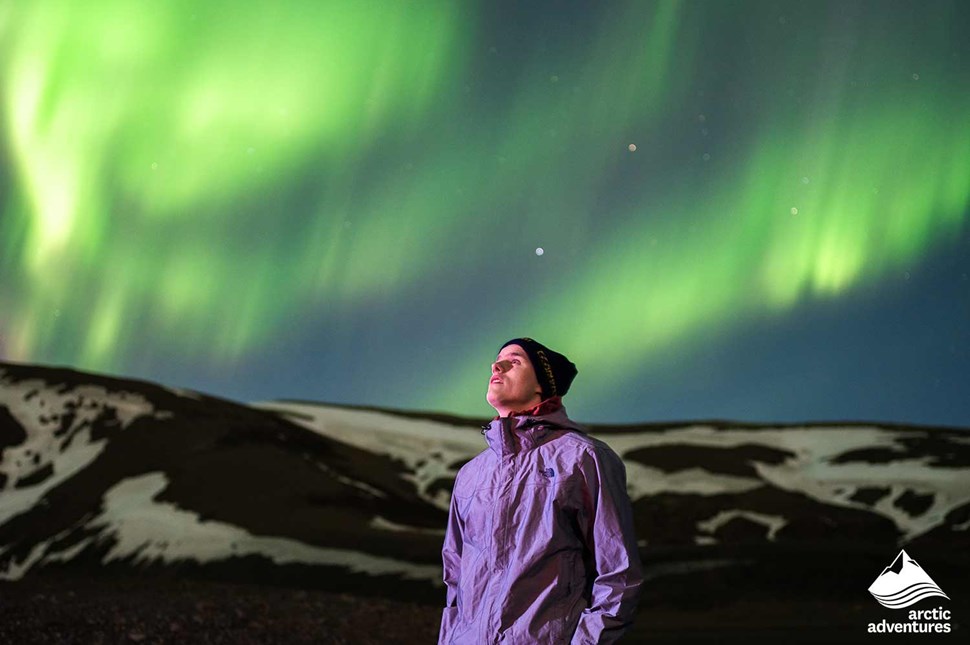 Happy Man Watching Northern Lights in Reykjavik