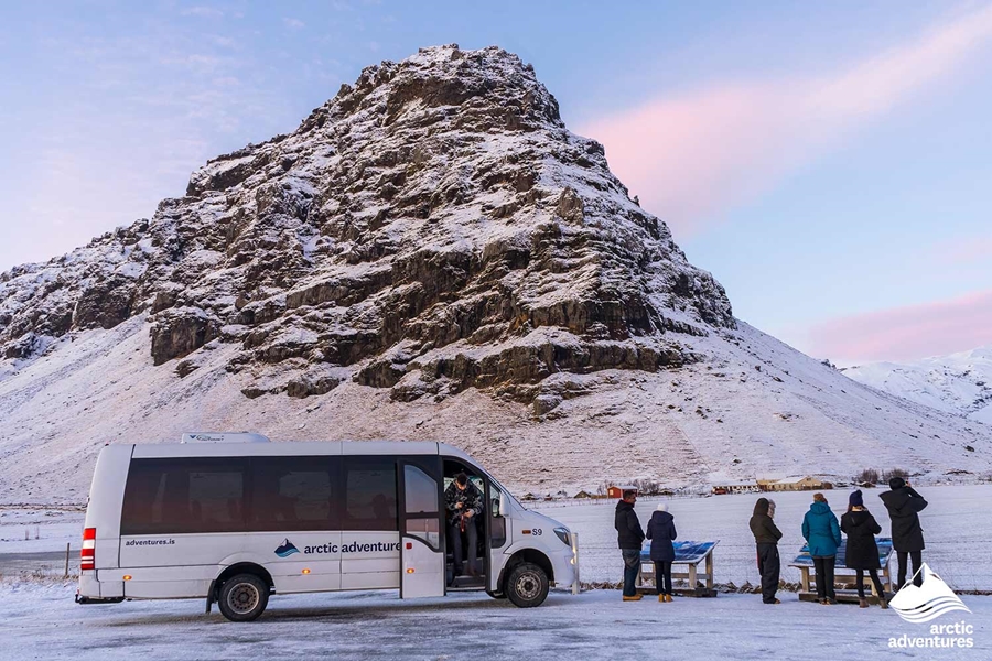 minibus with arctic adventures logo