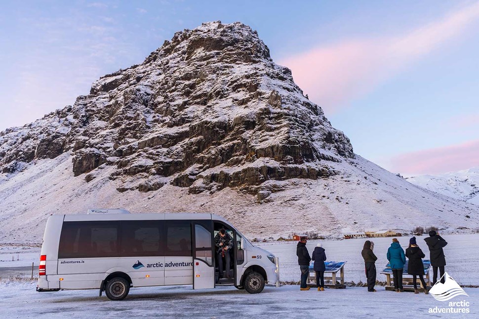minibus with arctic adventures logo in Iceland