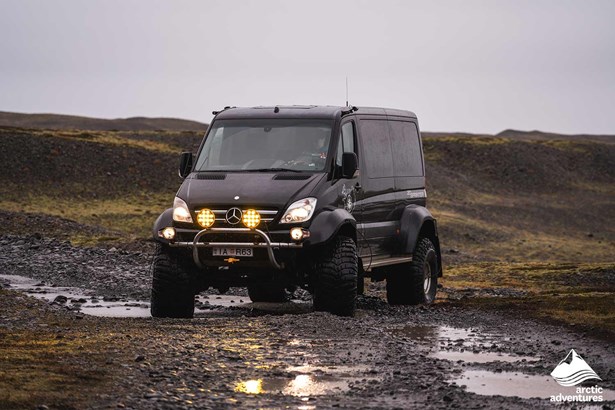 black super jeep driving in Iceland