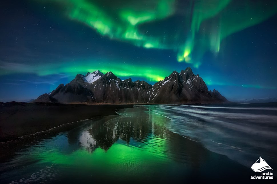 Aurora Borealis above the mountains in Iceland