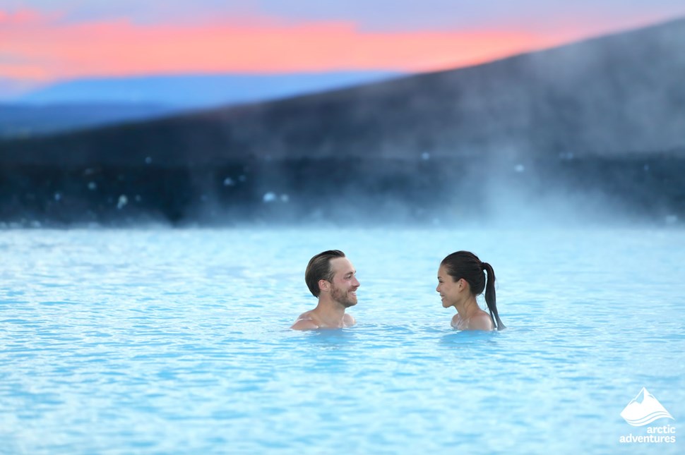 couple bathe in Icelandic blue lagoon