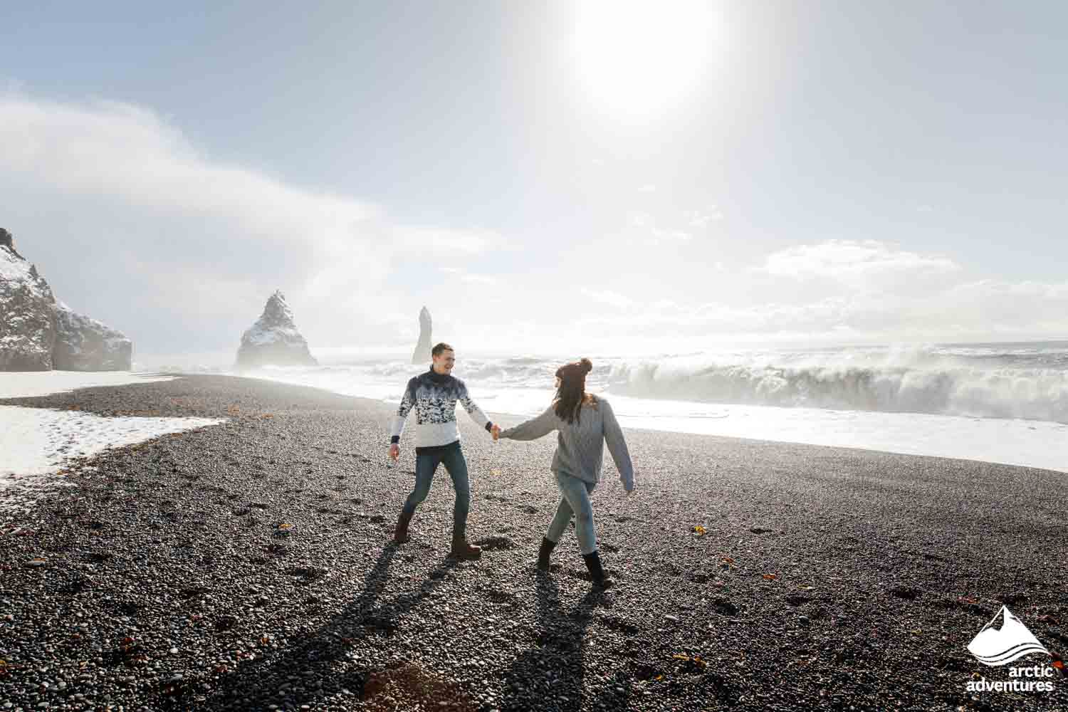 couple at Reynisfjara beach in Iceland