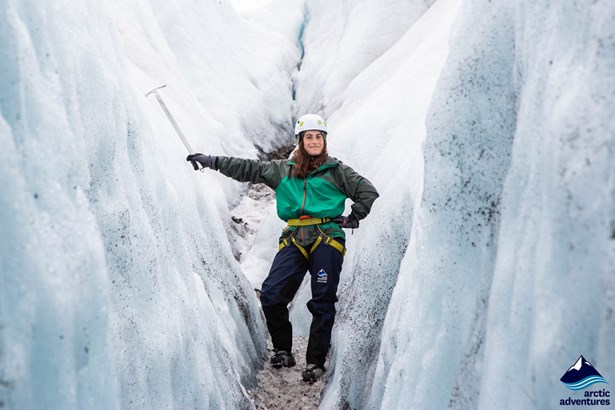 Woman posing in Ice Crevasse on Icelandic glacier