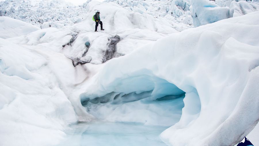 Woman walking by ice caves