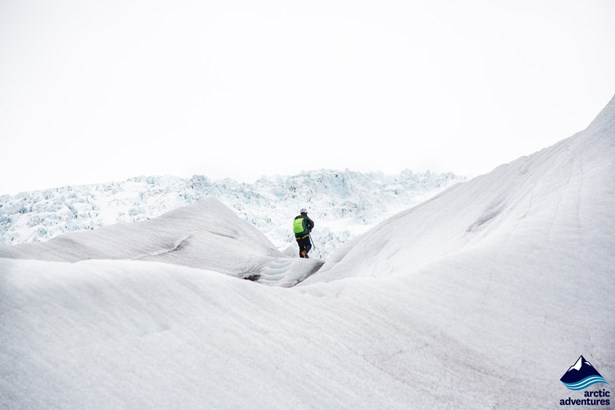 Person walking on a glacier in Iceland