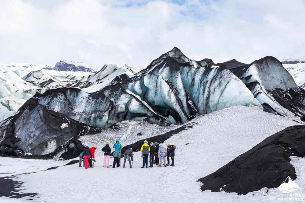 Group standing by glacier