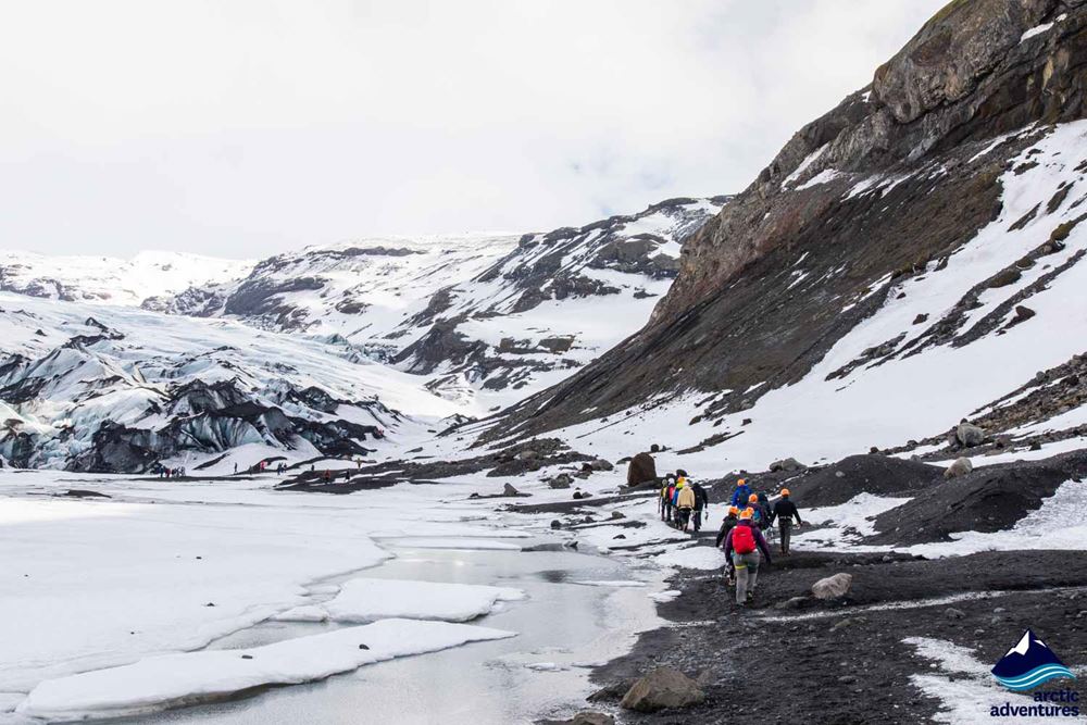 Group Hiking Towards Glacier