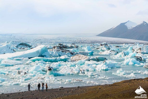 People near Jokulsarlon Glacier Lagoon in Iceland