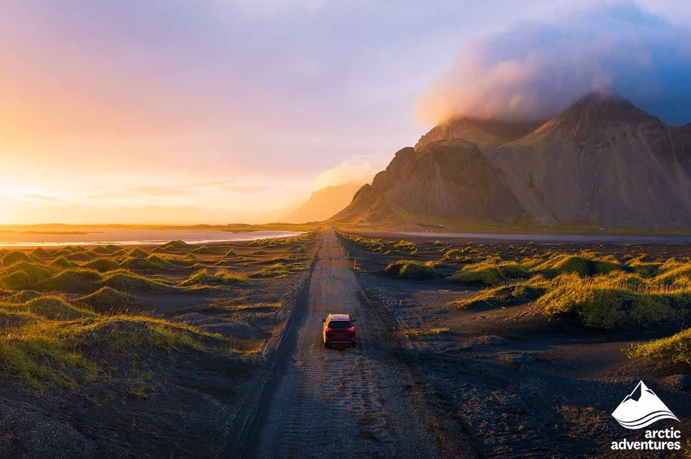 Car Driving by the Sunset in Iceland