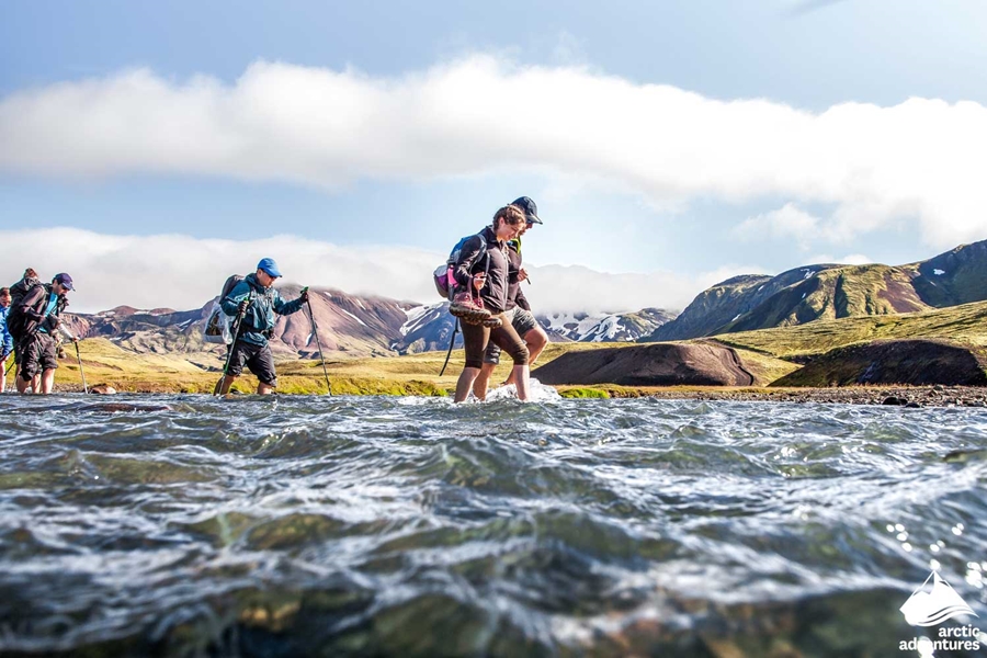 Small Group Crossing River in Iceland