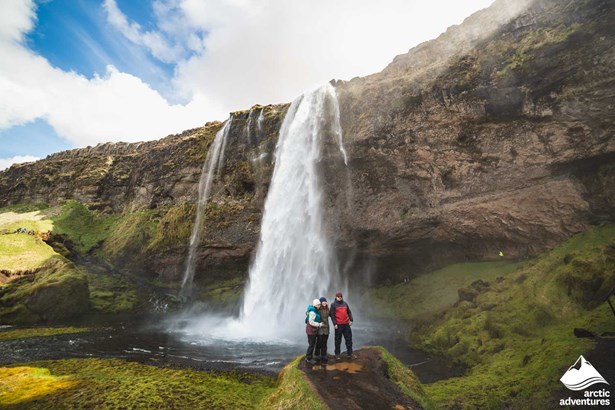 Family at Seljalandsfoss Waterfall in Iceland