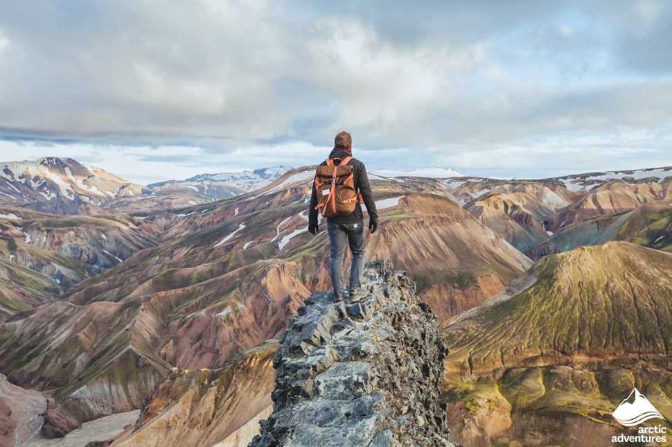 Man Standing on Cliff at Landmannalaugar Mountains