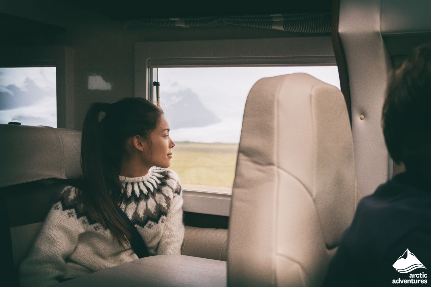 Woman Looking through Window in Bus