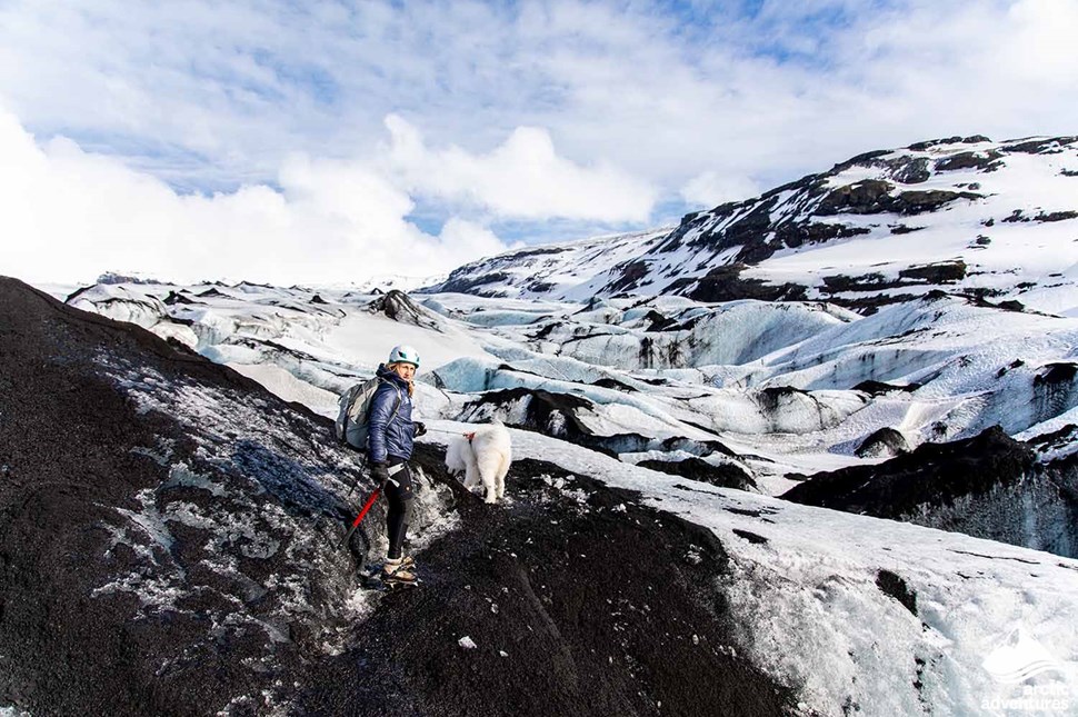 Woman Hiking on Glacier with Dog in Iceland