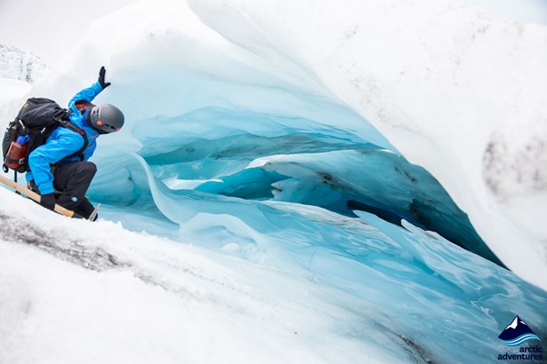 Man by Ice Crevasse on Vatnajokull Glacier