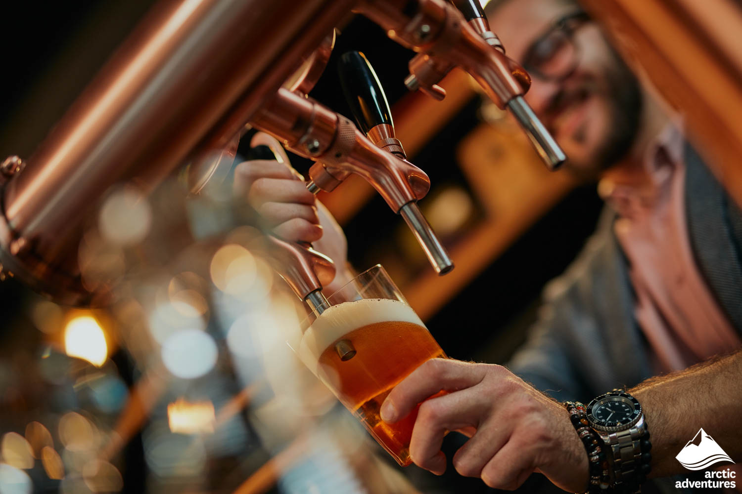 Bartender Pouring Beer from Tap in Bar