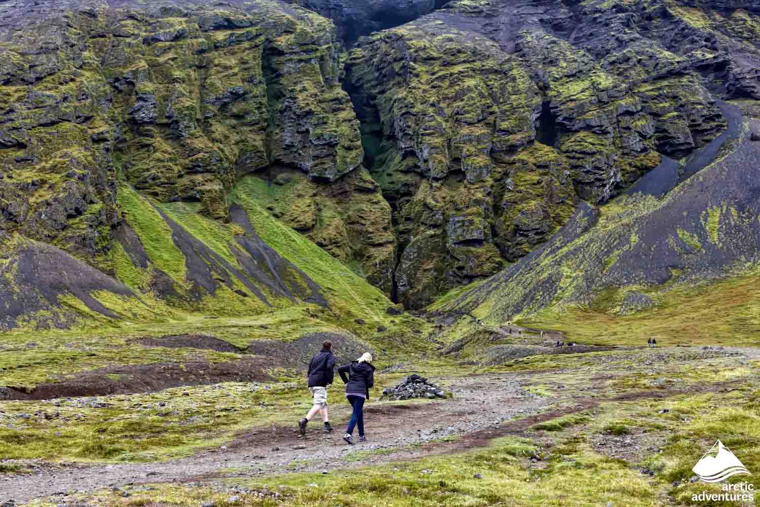 Couple Hiking to Raudfeldsgja Gorge