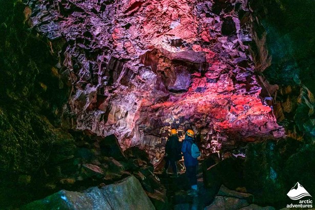 People Inside the Lava Cave in Iceland