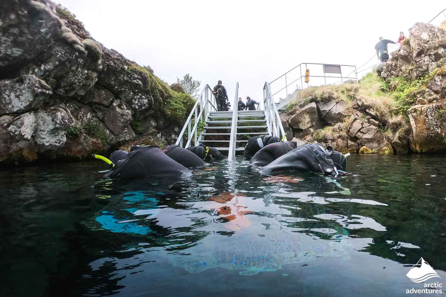 Snorkelers Getting into the Water in Iceland