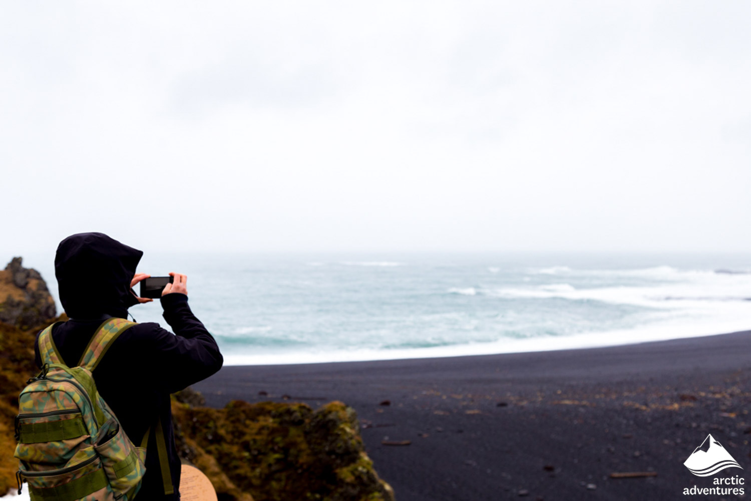 Man Taking Picture of Djupalonssandur Beach