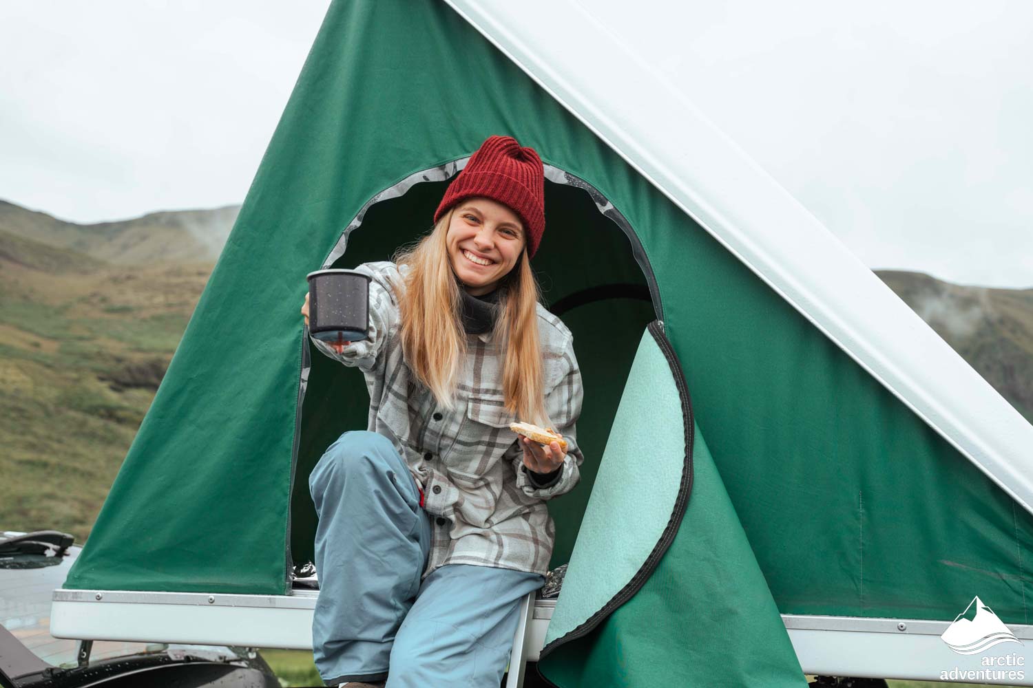 Woman Camping in Car Rooftop Tent