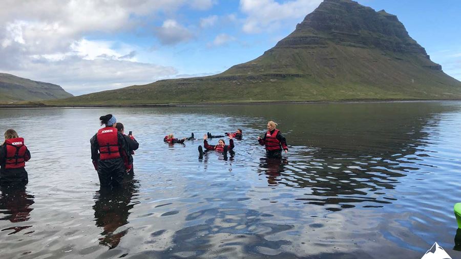 Group Swimming near Kirkjufell Mountain