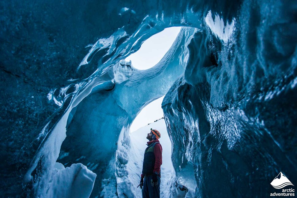 Man Inside of Ice Cave in Iceland