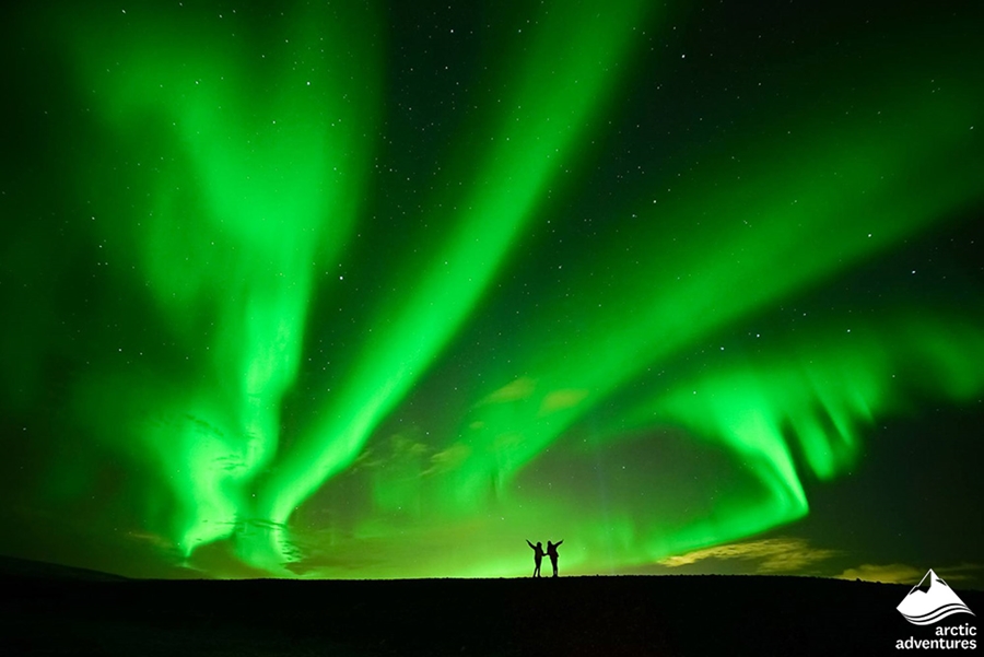 Northern Lights Above Two Friends