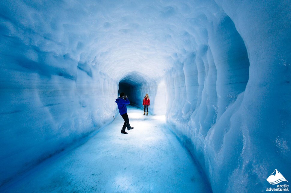 Couple Taking Pictures in Man-Made Ice Tunnel