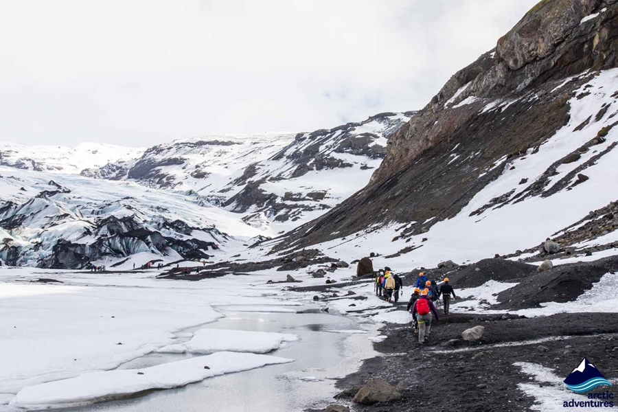 Group Walking Towards Glacier