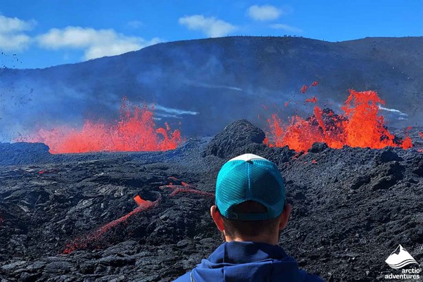 Man Watching Active Volcano in Iceland