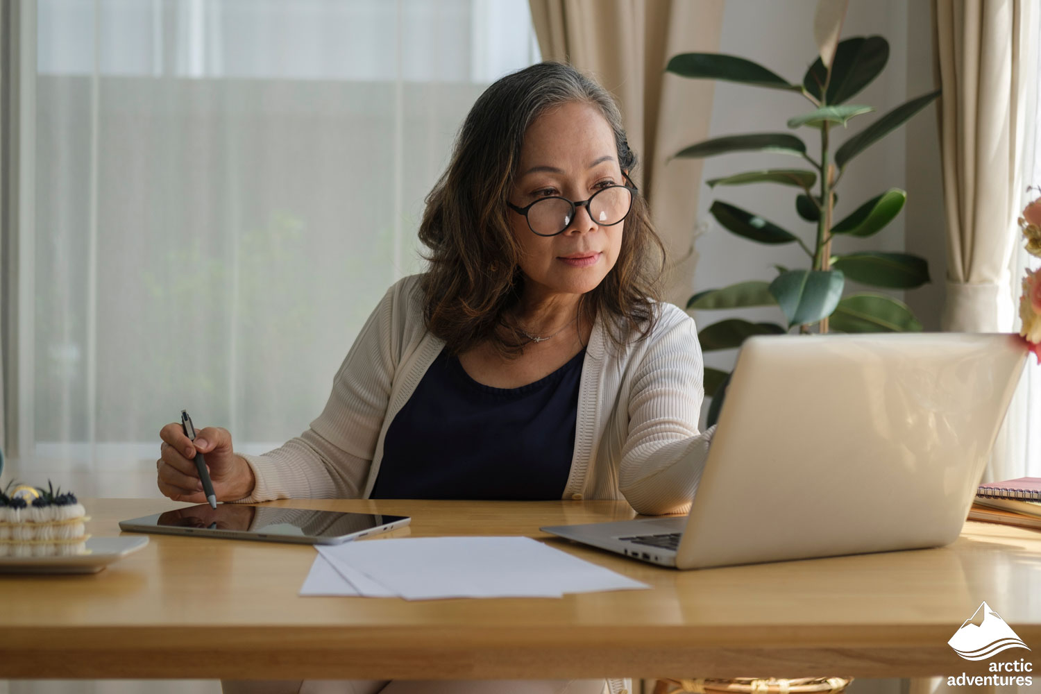 Woman Working with Computer and Tabloid