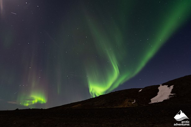 Northern Lights over the Hill in Iceland