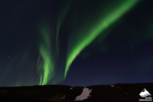 Aurora Borealis over the Mountain in Iceland