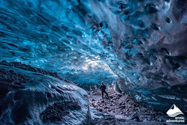 Woman Inside of the Blue Crystal Ice Cave