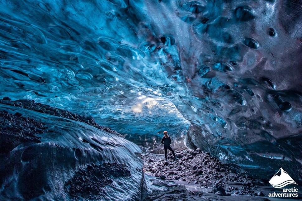 Woman Inside of the Blue Crystal Ice Cave