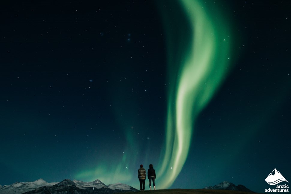 Couple Watching Aurora Borealis in Iceland