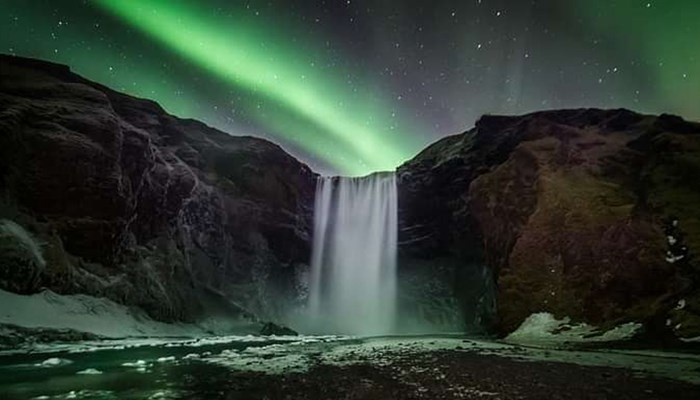 Northern Lights Over Skogafoss Waterfall