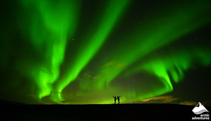 Couple Under the Northern Lights in Iceland