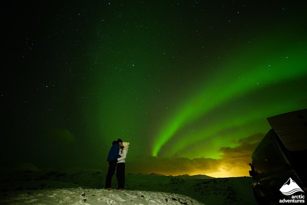 Couple Kissing Under Aurora in Iceland